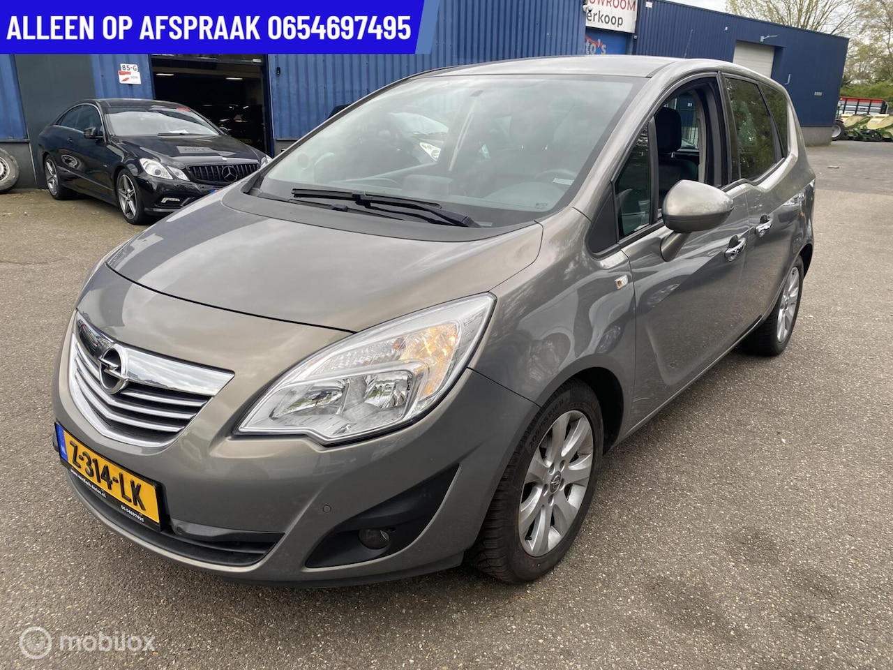 Opel Meriva - 1.4 Cosmo 93.DKM STOEL/STUUR VERW ECC NAVI PDC CRUISE LEDER - AutoWereld.nl