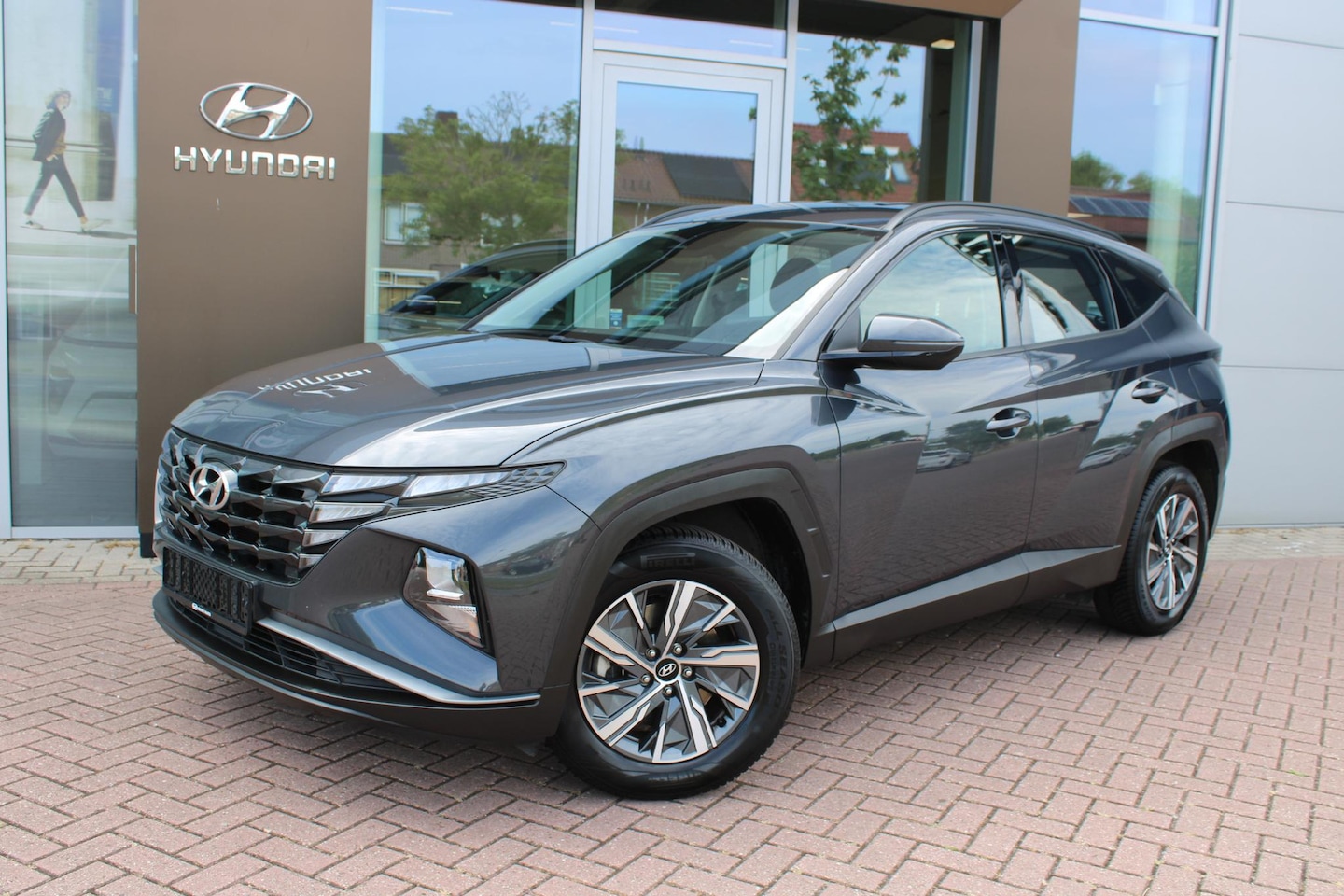 Hyundai Tucson - 1.6 T-GDI HEV 230 Comfort Hybrid Automaat Airco Navi Camera Carplay - AutoWereld.nl