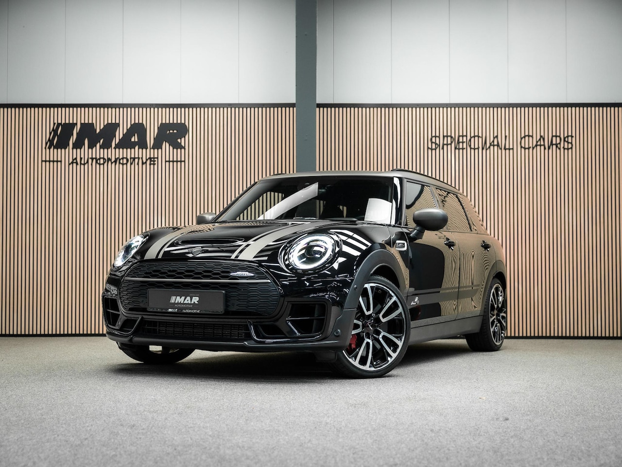 MINI Clubman - 2.0 JCW ALL4 John Cooper Works | JCW | Rood dak | Sportstoelen | Stoelverwarming | Head-Up - AutoWereld.nl