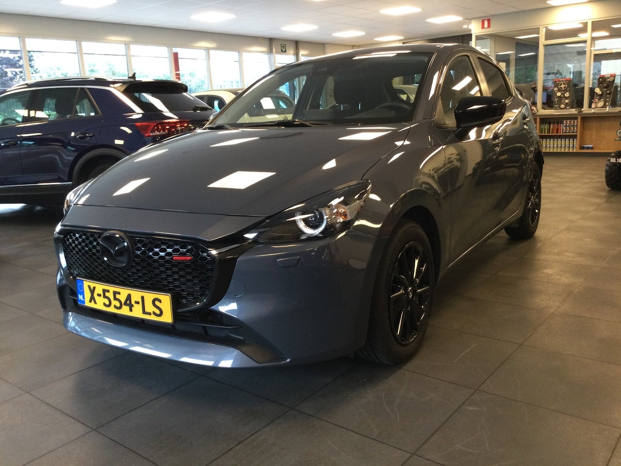 Mazda 2 - 1.5 e-SkyActiv-G 90 Homura Camera-PDC-Stuurverwarming-Stoelverwarming-LED-Carplay - AutoWereld.nl