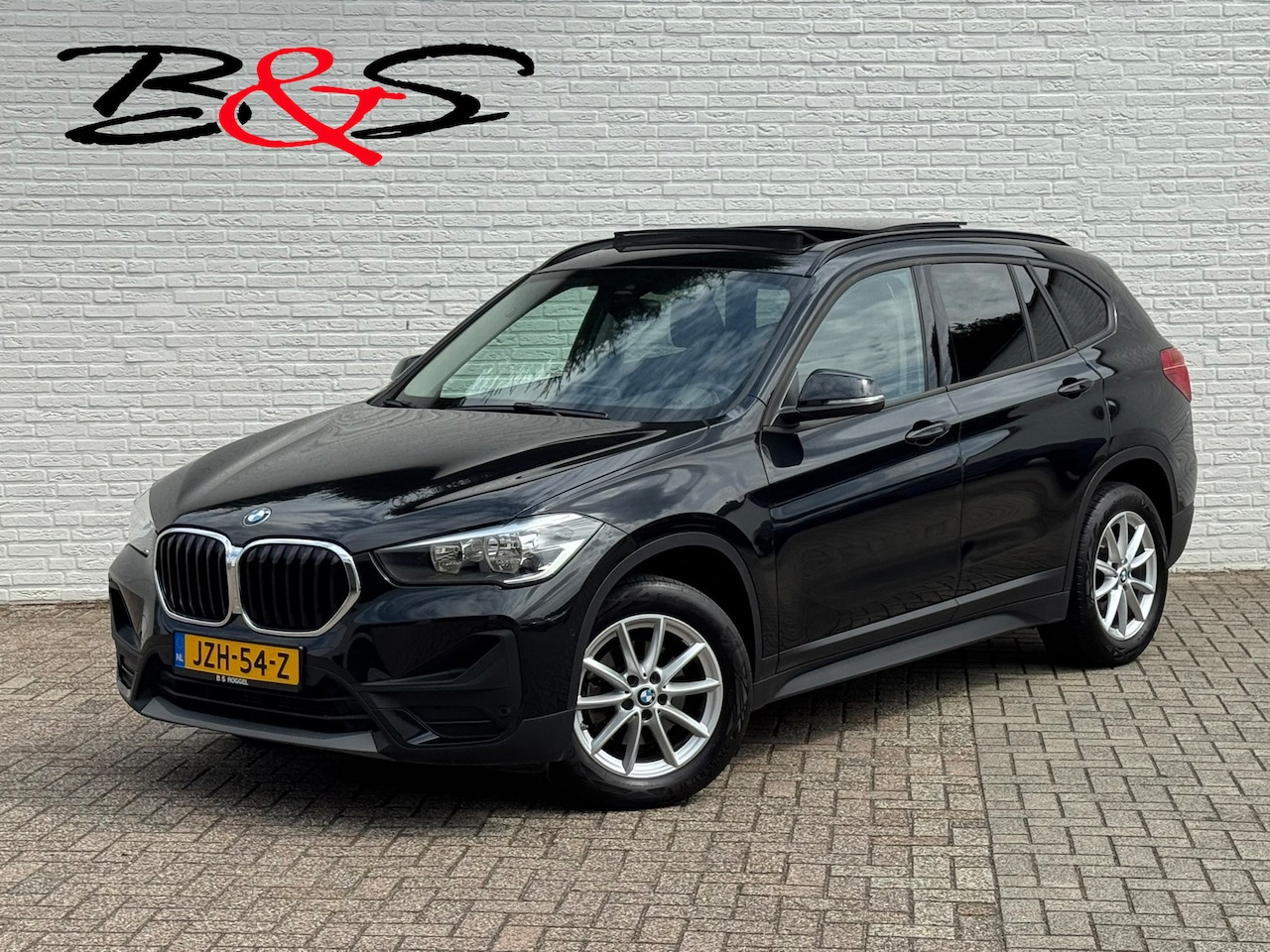 BMW X1 - SDrive 1.8i High Executive Head Up display Climate Cruise Pano Leer Navi PDC voor en achte - AutoWereld.nl