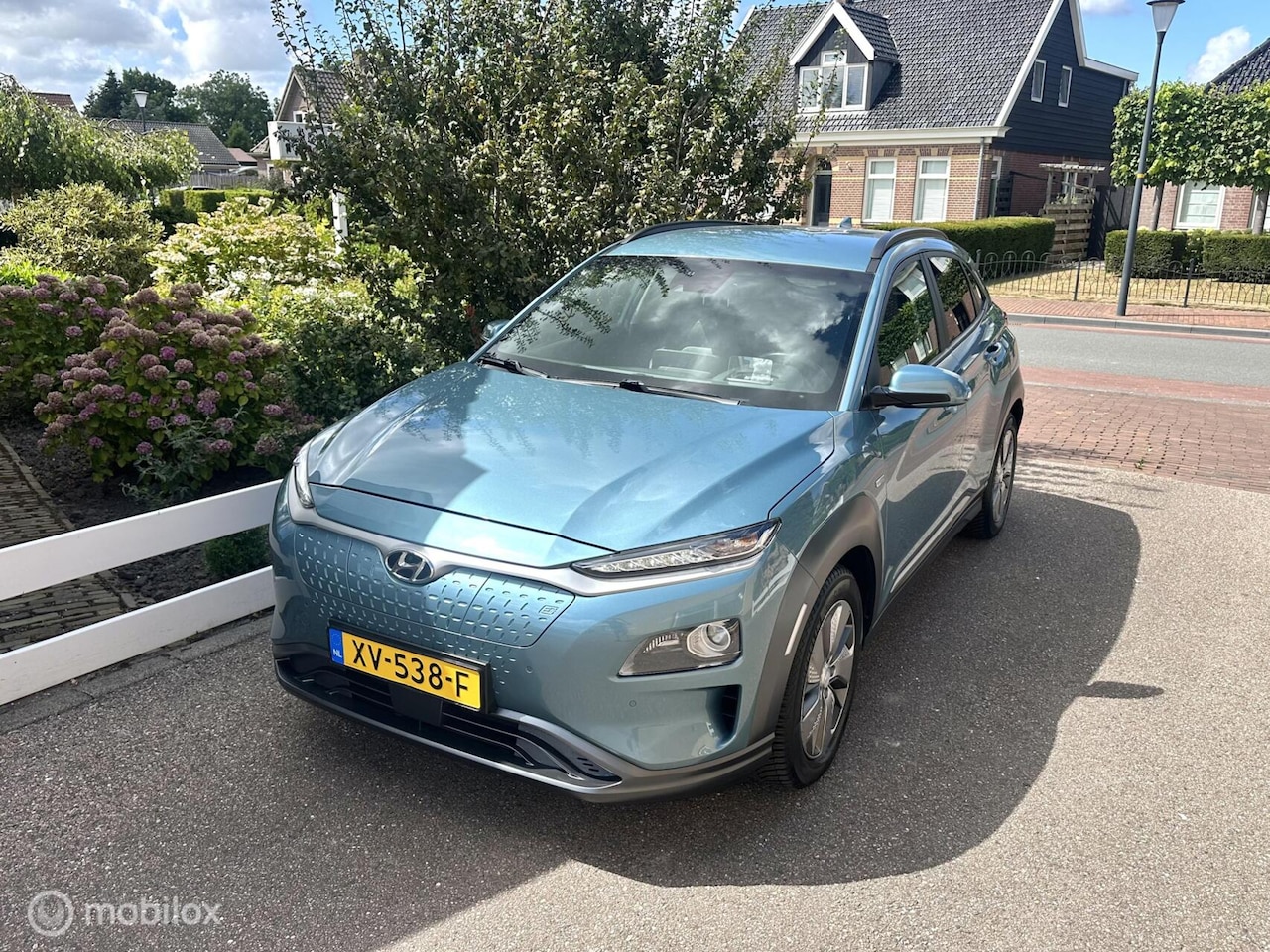 Hyundai Kona Electric - EV Premium 64 kWh SOH 100% WARMTE POMP ACHTERUITRIJ CAMERA NAVIGATIE STOELVERWARMING/KOELI - AutoWereld.nl