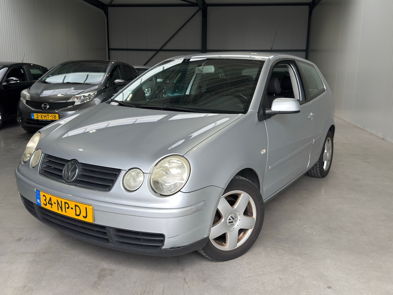 Volkswagen Polo - 1.4-16V Highline st verwarming navigatie - AutoWereld.nl
