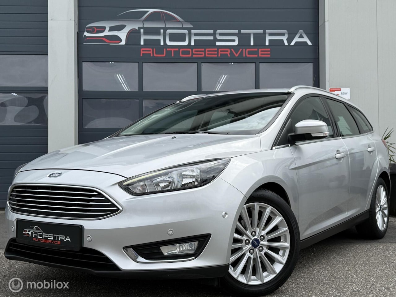 Ford Focus Wagon - 1.0 Titanium PDC Clima Navi Cruise Orig-NL - AutoWereld.nl
