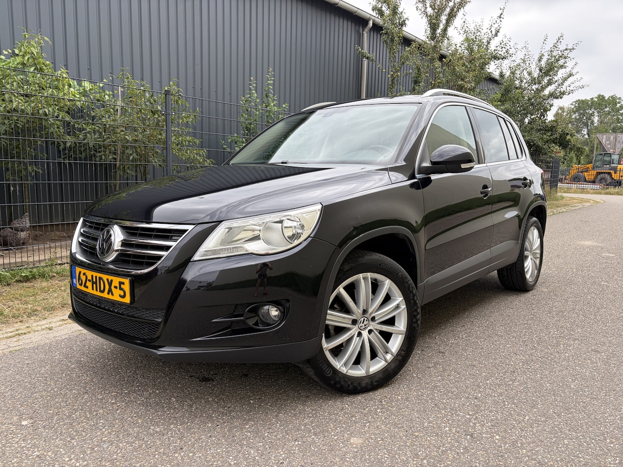 Volkswagen Tiguan - 2.0 TSI Sport&Style 4Motion / LEER / NAVI / AIRCO ECC / STOELVERW / 126dkm! NAP! - AutoWereld.nl