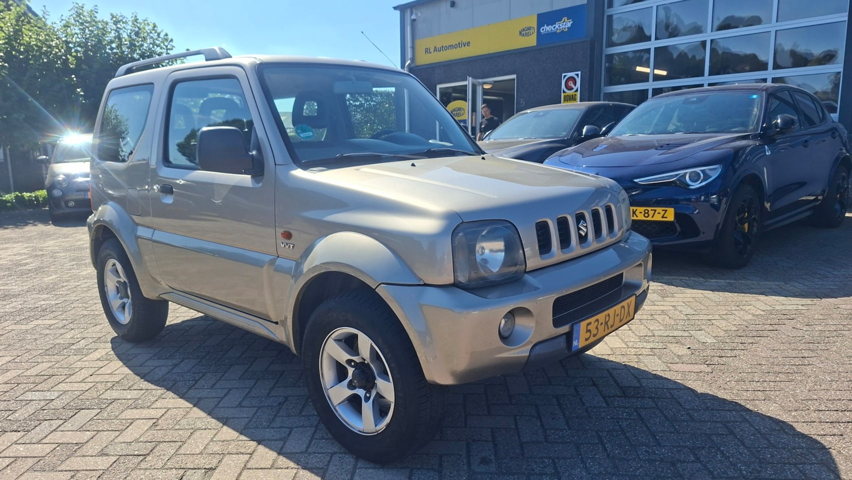 Suzuki Jimny - 1.3 Exclusive - 4 x 4 - Airco - Trekhaak - AutoWereld.nl