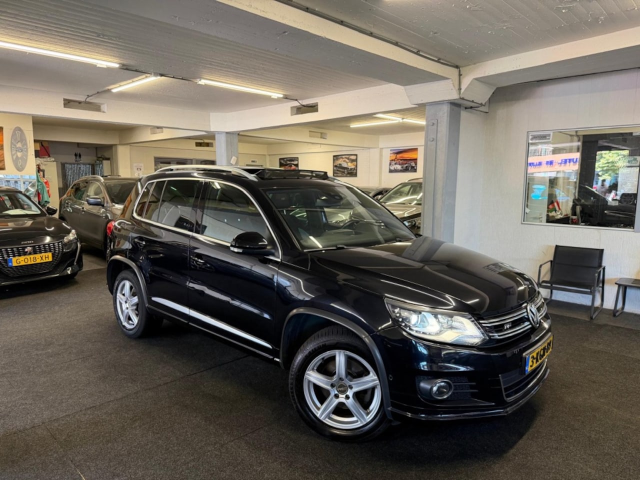 Volkswagen Tiguan - 1.4 TSI Sport&Style R-line*Schuifdak*Camera*Alcantara - AutoWereld.nl