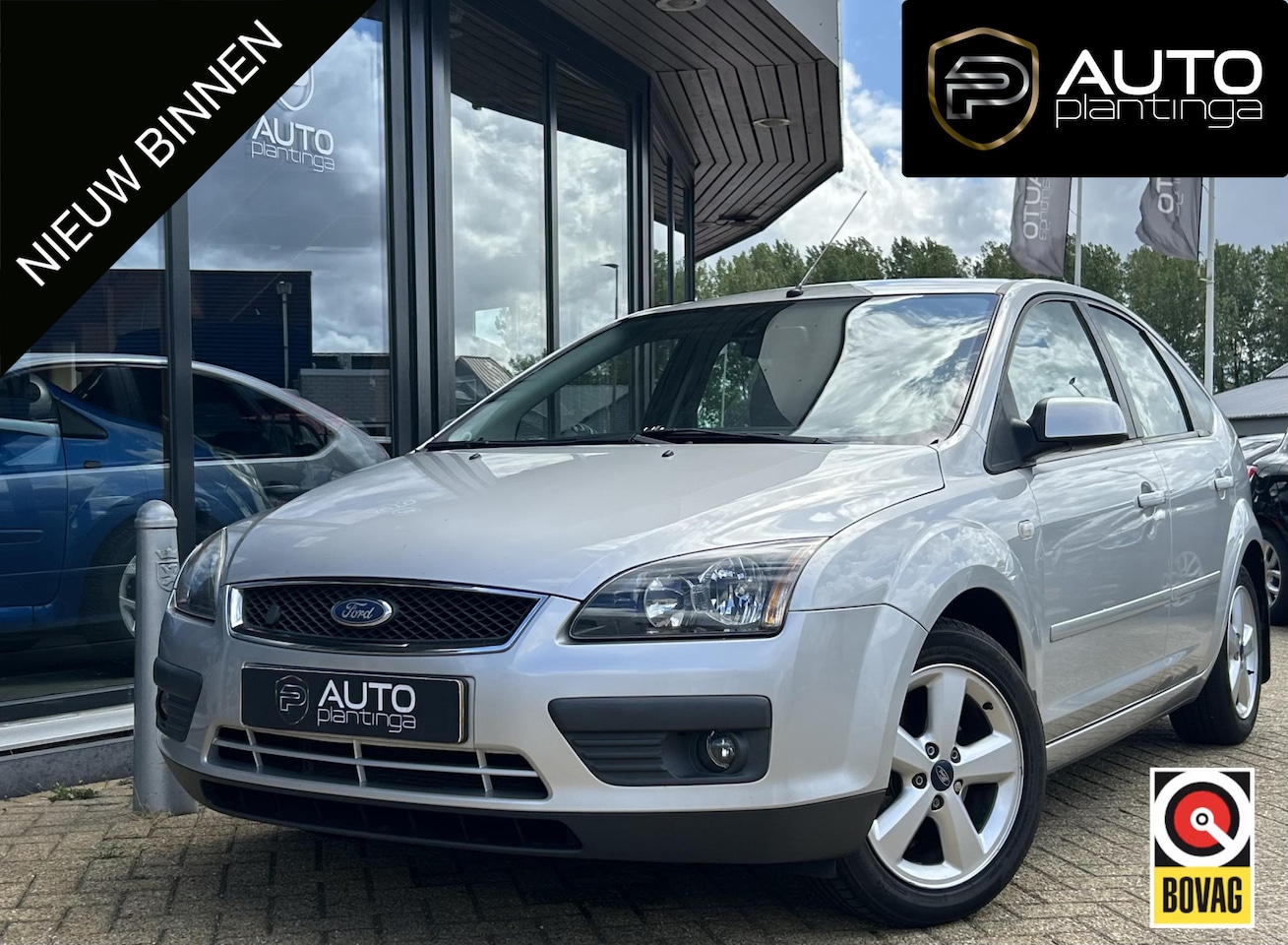 Ford Focus - 1.8-16V Ambiente Flexifuel 125PK | Trekhaak | Airco | Cruise Control | Elektrische Stoel | - AutoWereld.nl