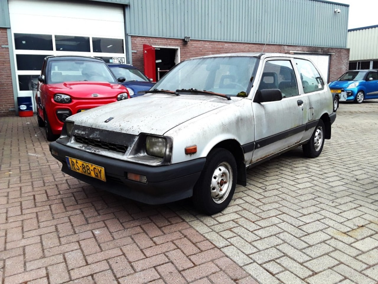 Suzuki Swift - 1.0 GL AUTOMAAT / OPKNAPPER - AutoWereld.nl