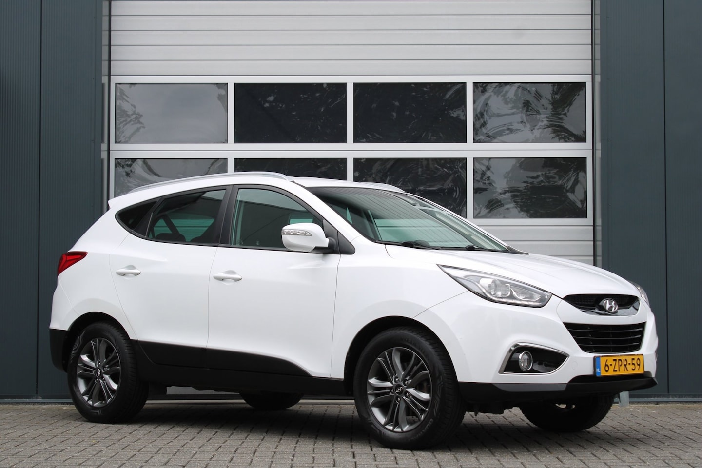 Hyundai ix35 - 2.0i Business Edition Automaat Clima/Cruise/Camera/Stoelverwarming/PDC/Navi/Bluetooth/LED/ - AutoWereld.nl