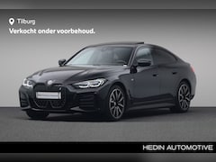 BMW i4 - eDrive40 High Executive 84 kWh | Harman Kardon | Stuurwielrand verwarmd | Glazen schuif-/k