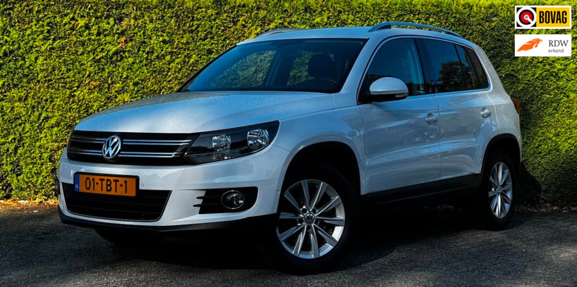 Volkswagen Tiguan - 1.4 TSI Sport&Style*MotorRevisie*Navi*CruiseControl*NAP* - AutoWereld.nl