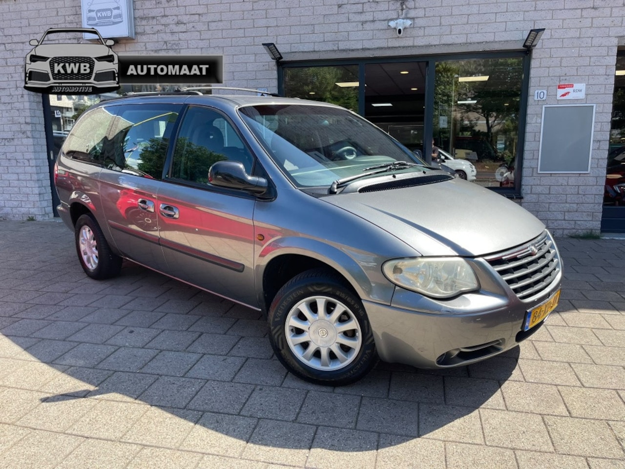 Chrysler Grand Voyager - 3.3i V6 SE Luxe Trekhaak DVD 7Pers - AutoWereld.nl