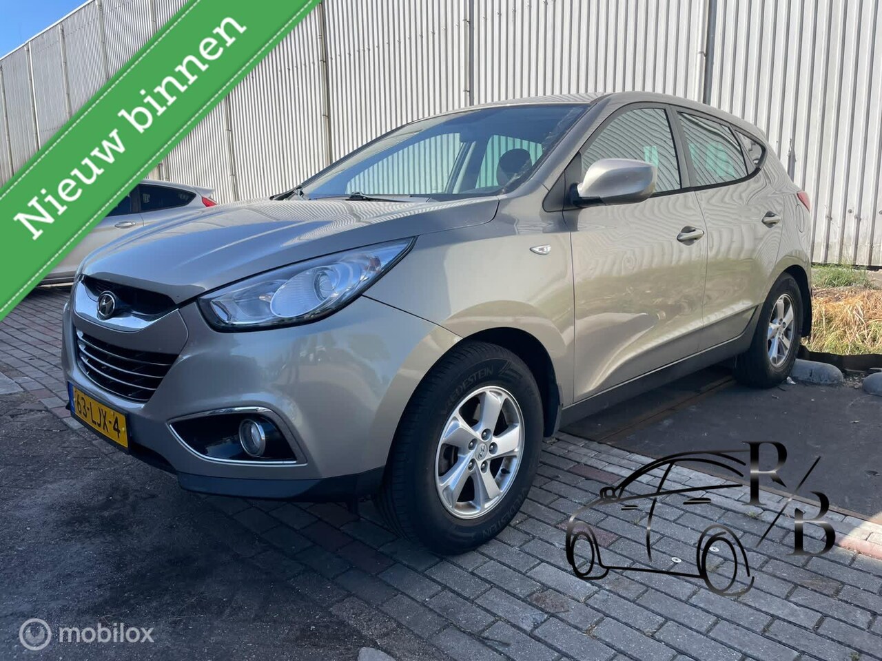 Hyundai ix35 - 2.0i Dynamic LPG ZEER MOOIE AUTO AIRCO CRUISE - AutoWereld.nl