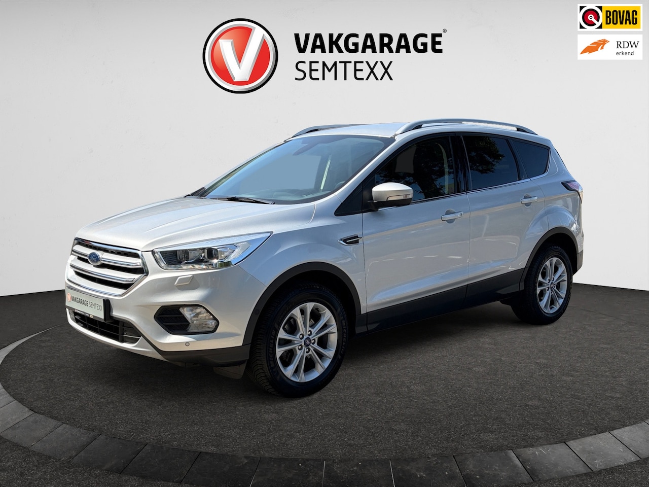 Ford Kuga - 1.5 EcoBoost Titanium | Clima | Cruise | Camera | Navi | Wegklapbare Trekhaak | Apple Carp - AutoWereld.nl