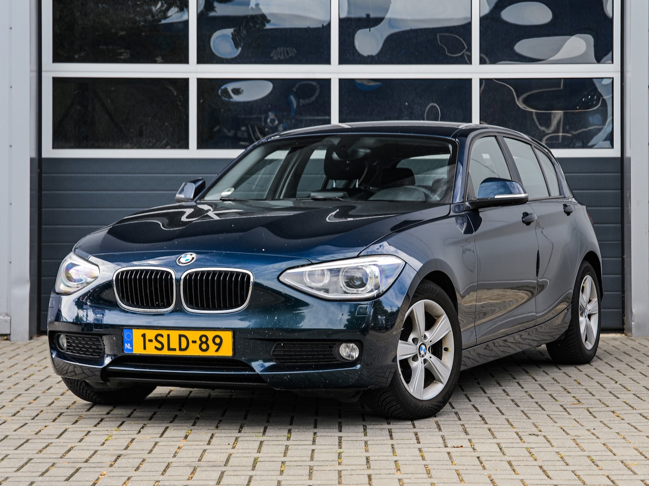 BMW 1-serie - 116i Executive | Navi | Xenon | PDC | Climate control | Cruise control | 16'' velgen - AutoWereld.nl