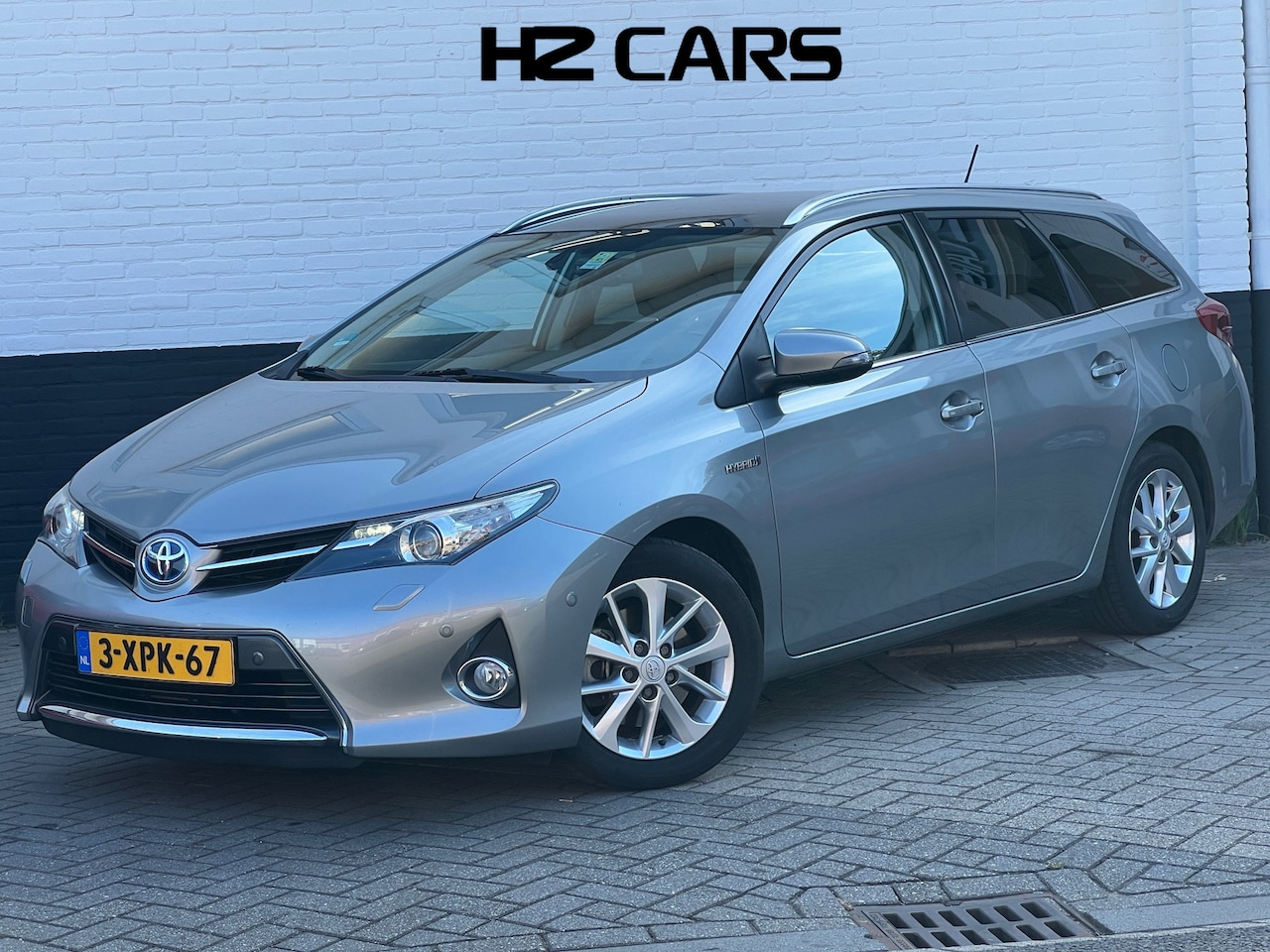 Toyota Auris Touring Sports - 1.8 Hybrid Lease+|Pano|Trekhaak|Keyless|Camera - AutoWereld.nl