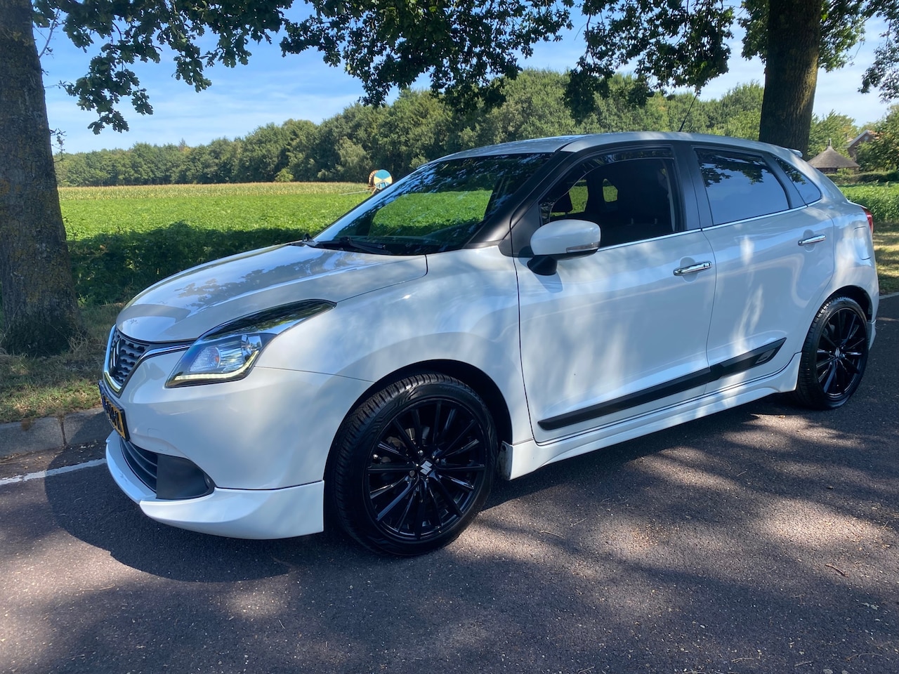 Suzuki Baleno - 1.2 Smart Hybrid High Executive 1.2 Smart Hybrid High Executive - AutoWereld.nl