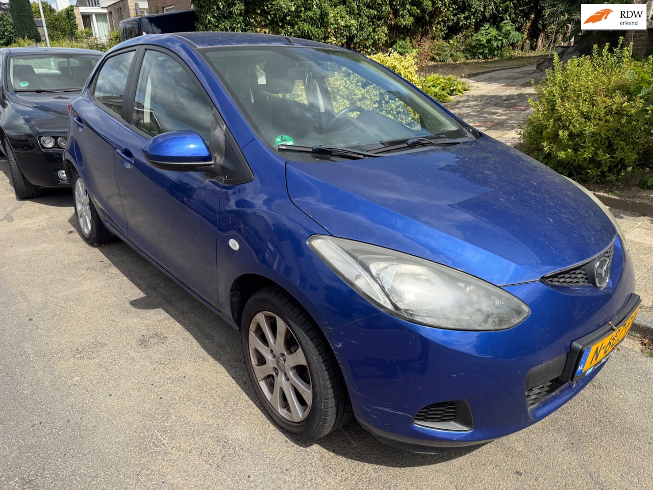 Mazda 2 - 1.3hp S-VT Touring RIJDSUPER!/AIRCO/5DRS/APK 12-26! - AutoWereld.nl