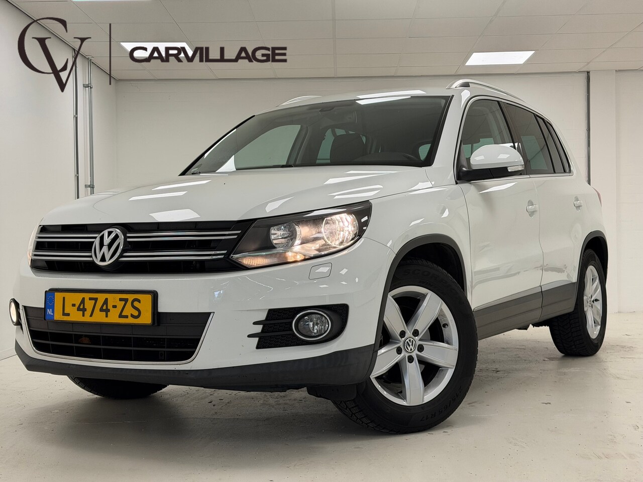 Volkswagen Tiguan - 1.4 TSI Sport&Style | Navi | Stoelverwarming | Clima Stoelverwarming | Navi - AutoWereld.nl