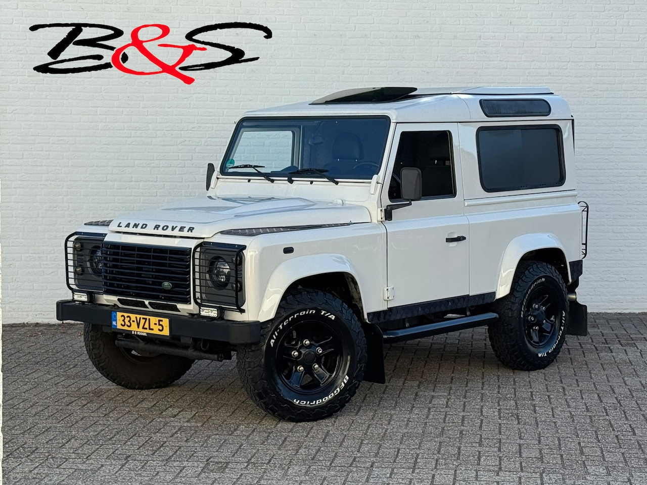 Land Rover Defender - 2.4 TD HT 90" E Marge Grijs kenteken Led Trekhaak 3500kg Airco Schuifdak Topstaat! - AutoWereld.nl