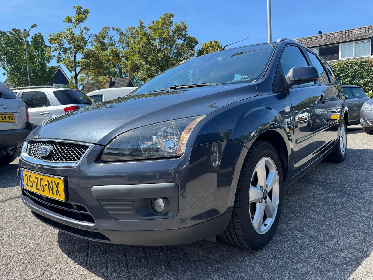 Ford Focus Wagon - 1.8-16V Ambiente Flexifuel Apk 24/8/27,Airco,Cruise,Navi,St verw. - AutoWereld.nl