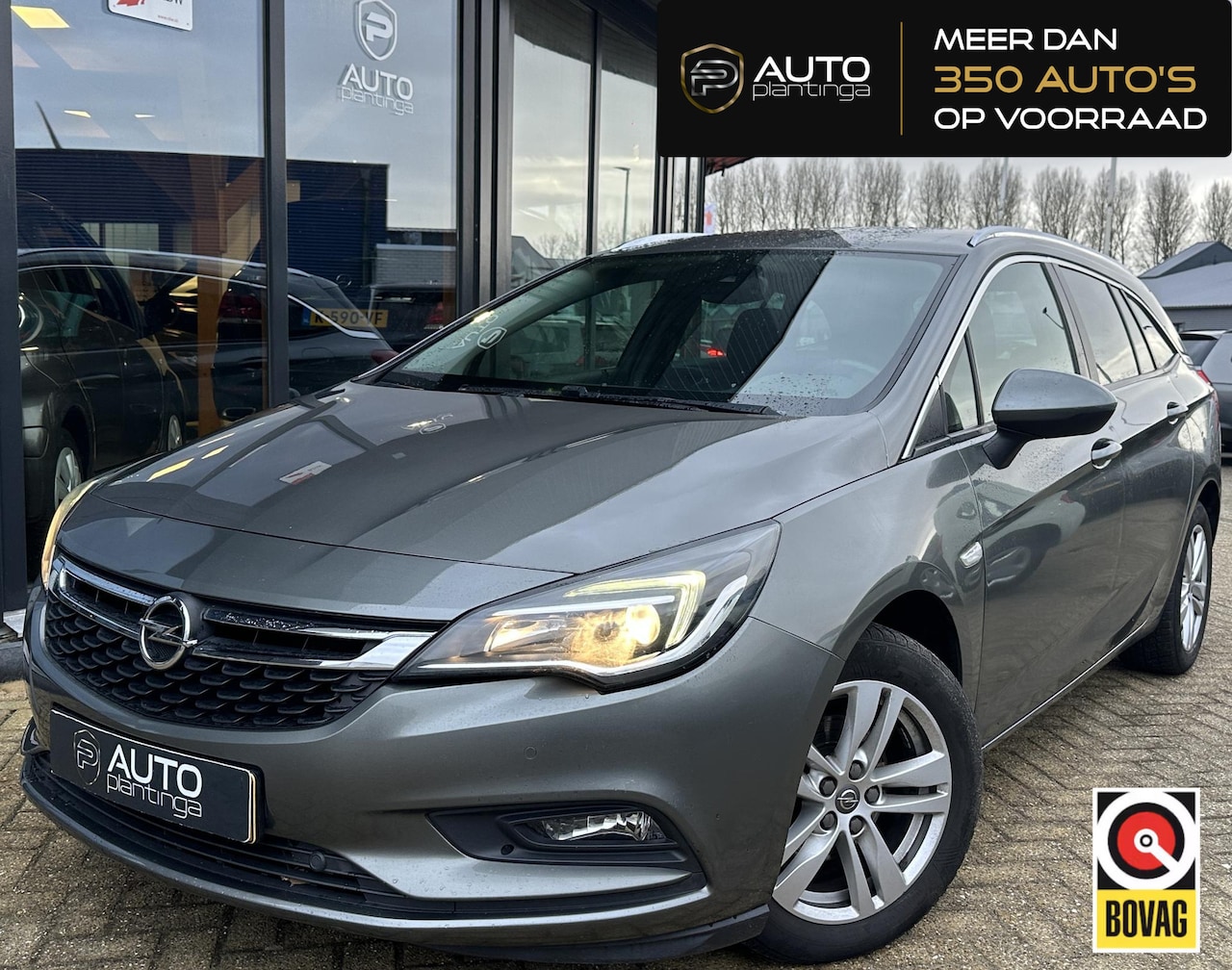Opel Astra Sports Tourer - 1.4 Turbo 120 Jaar Edition 150PK | AUTOMAAT | ZEER NETTE STAAT | Trekhaak | Stoel en Stuur - AutoWereld.nl