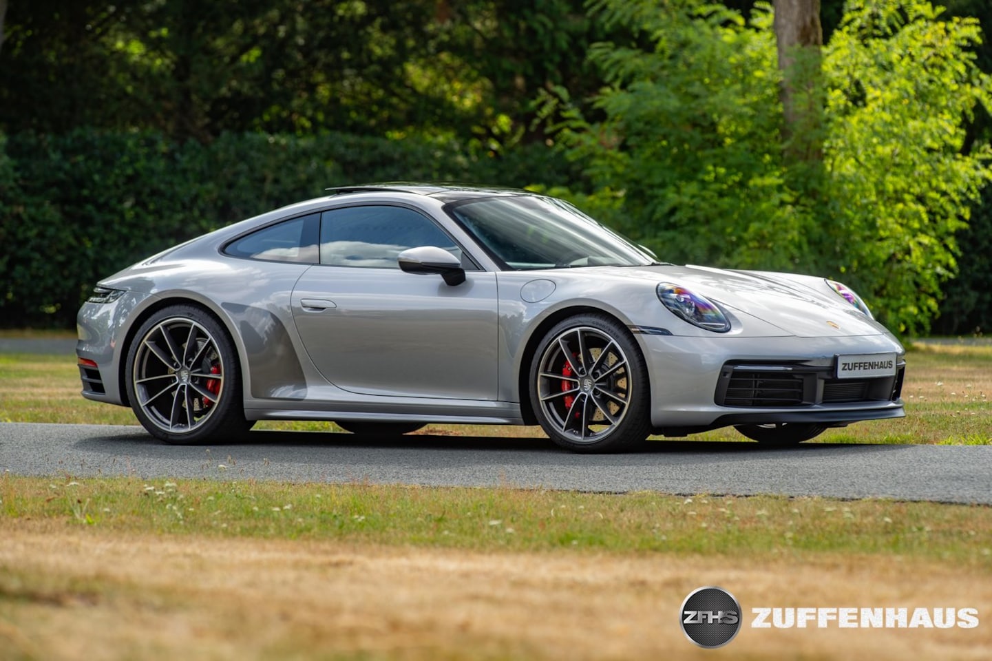 Porsche 911 - 3.0 Carrera S handbak achterasbesturing bose sportchrono - AutoWereld.nl