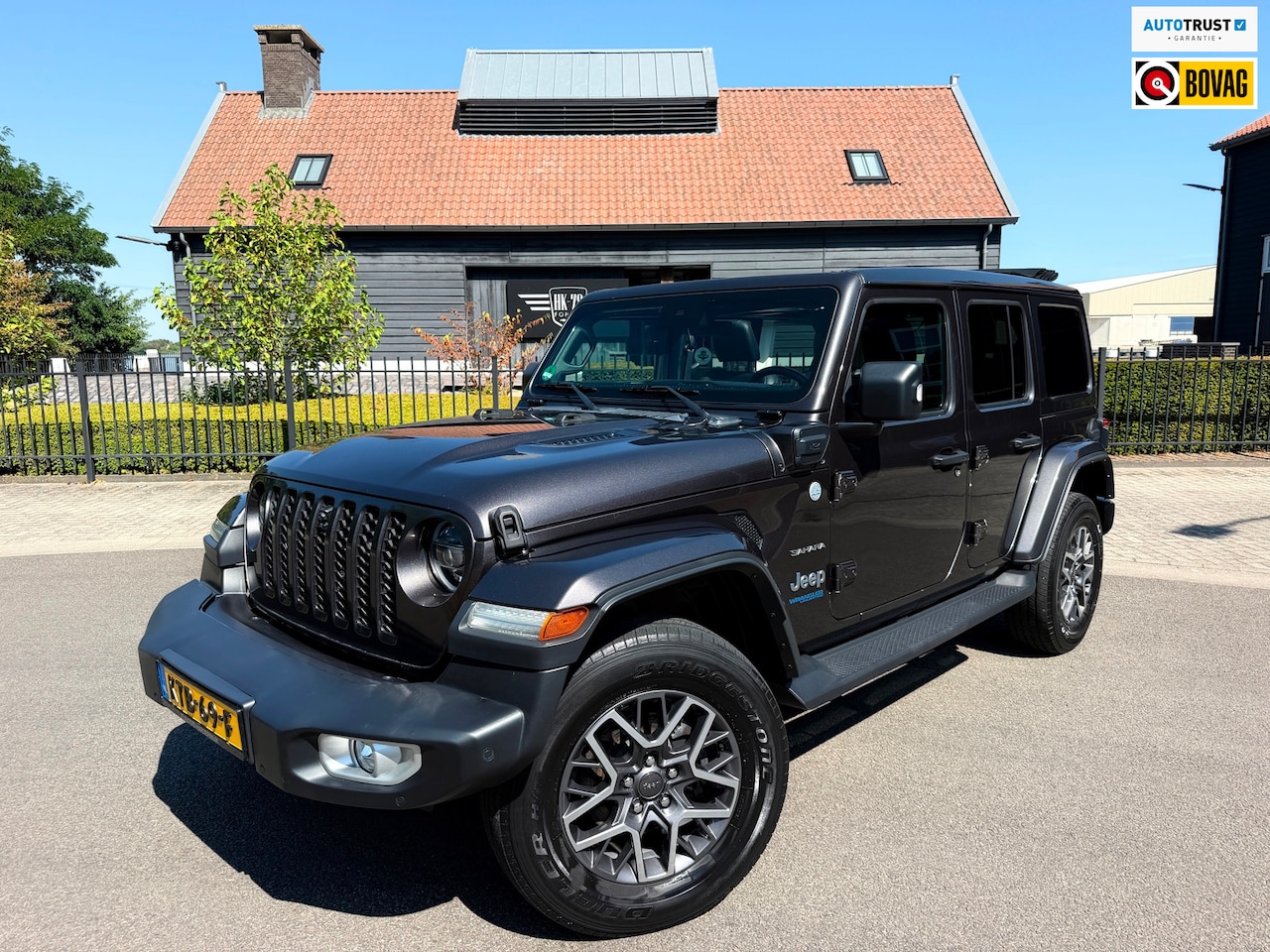 Jeep Wrangler Unlimited - Jeep Wrangler 380 Unlimited/Sahara 2.0 PHEV Softtop AWD 4x4 Leer Navi Led-Xenon - AutoWereld.nl