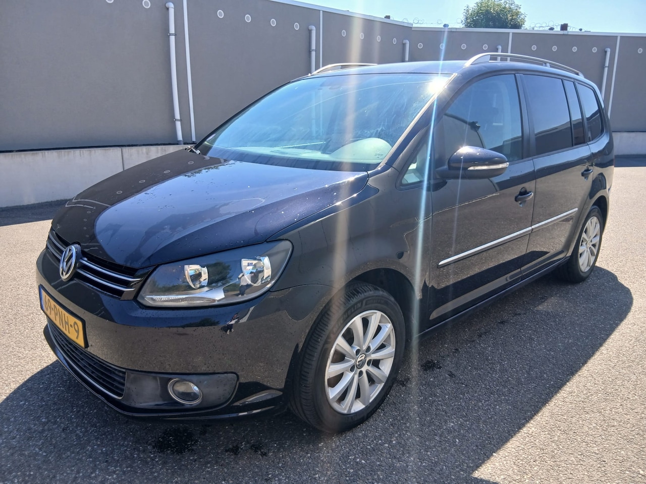 Volkswagen Touran - 1.2 TSI Highline BlueMotion 7p. 1.2 TSI Highline BlueMotion 7p. - AutoWereld.nl