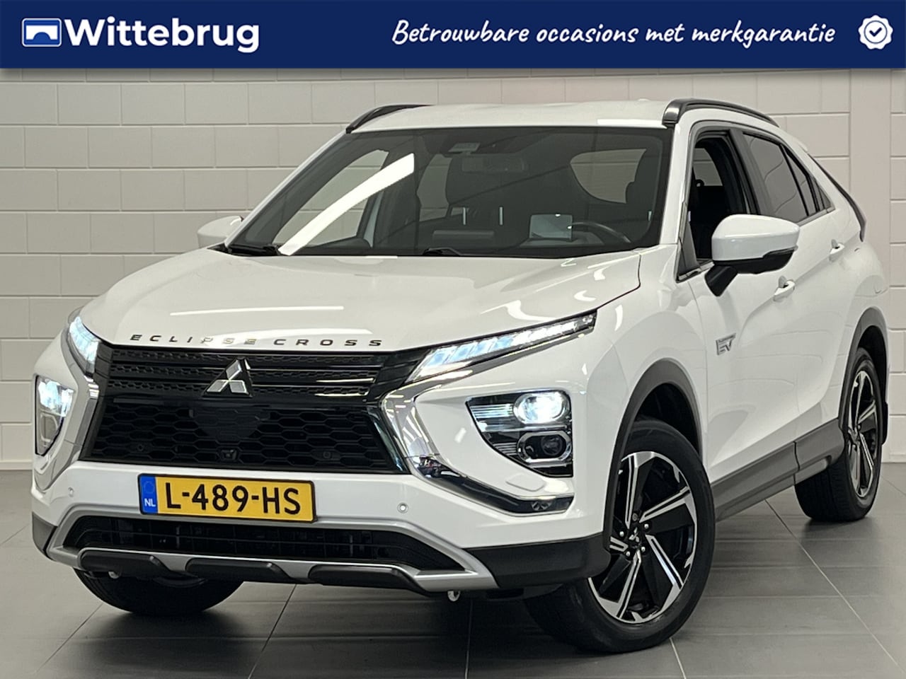 Mitsubishi Eclipse Cross - 2.4 PHEV First Edition TREKHAAK | NAVIGATIE | PLUG IN HYBRID MET 1500 KG TREKGEWICHT - AutoWereld.nl