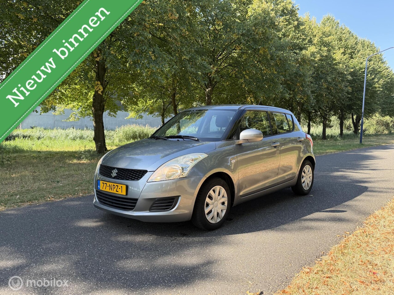 Suzuki Swift - 1.2 Comfort*NEW APK 08/27*AIRCO*STOELVERWARMING - AutoWereld.nl