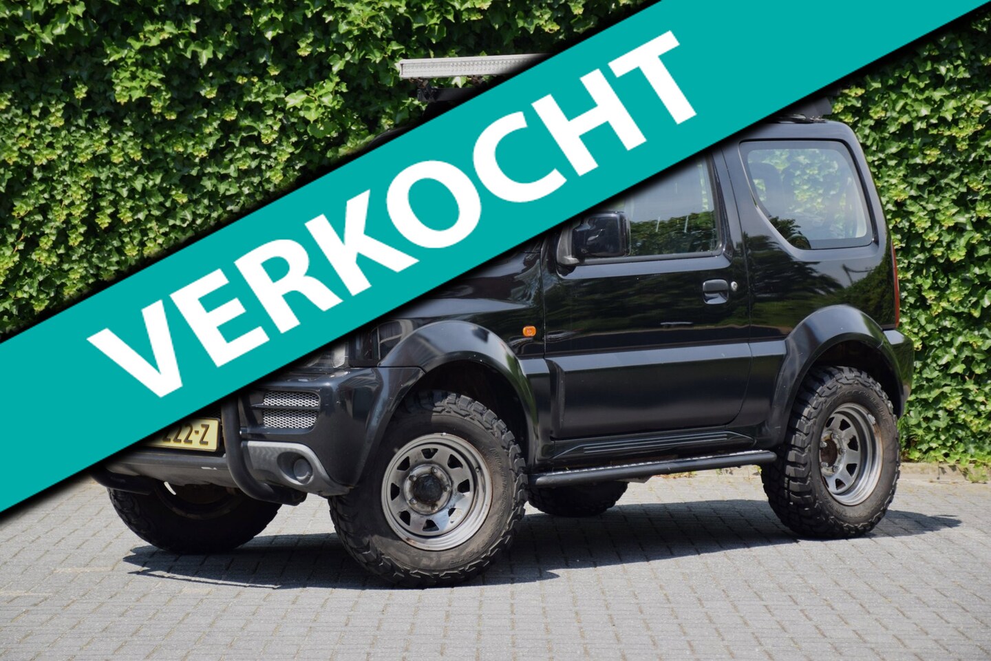 Suzuki Jimny - 1.3 JLX Airco/Garantie/Compleet aangepast/Verhoogd - AutoWereld.nl
