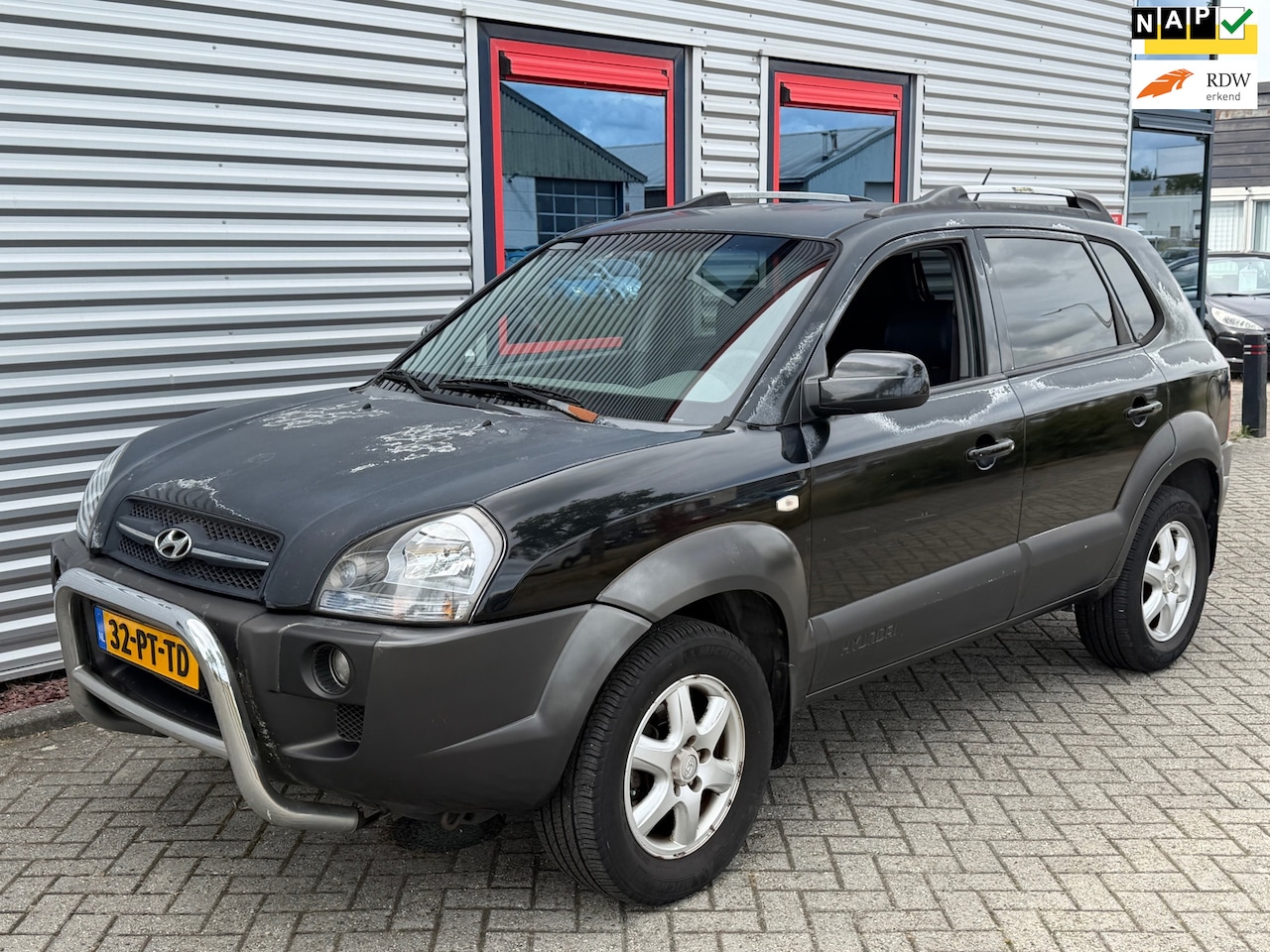 Hyundai Tucson - 2.0i Dynamic Airco Leder - AutoWereld.nl