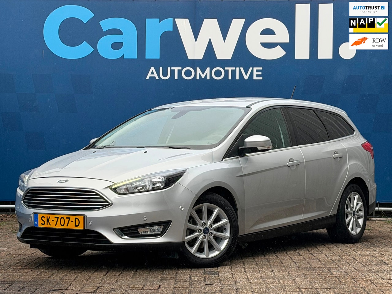 Ford Focus Wagon - 1.0 Titanium|2e Eigenaar|6Bak-125PK|Trekhaak|Navi|Climate|Cruise|PDC V+A|CarPLay|N.A.P|Apk - AutoWereld.nl