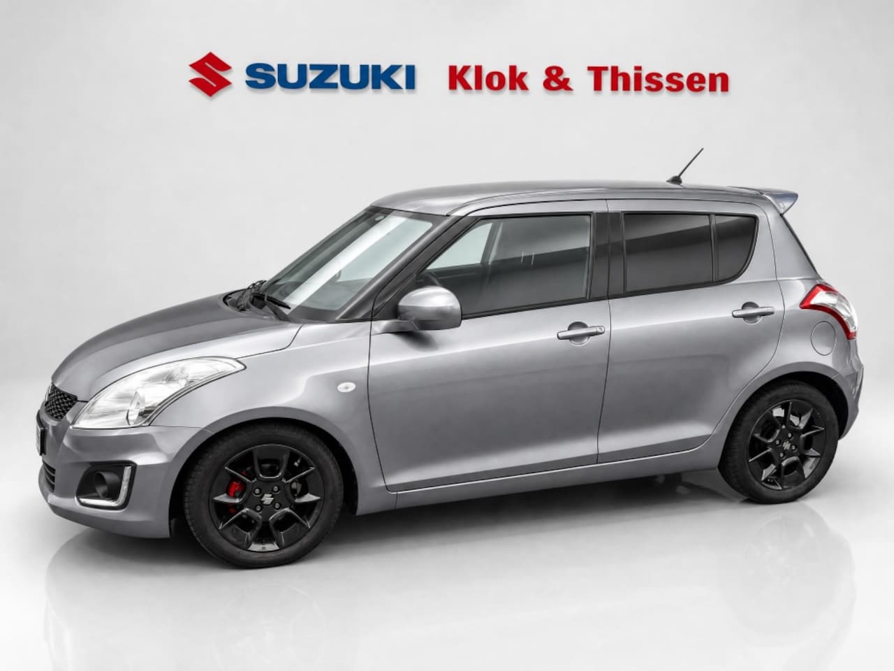 Suzuki Swift - AIRCO Trekhaak Achterklepspoi 1.2 Bandit Sportvelgen All-seasons Parkeersensoren Cruise Co - AutoWereld.nl