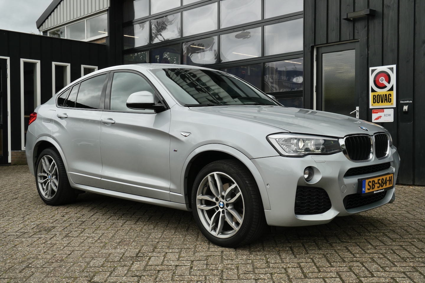 BMW X4 - xDrive20i High Executive M Sport Edition | NL-Auto | Trekhaak | Cruise | Leder - AutoWereld.nl