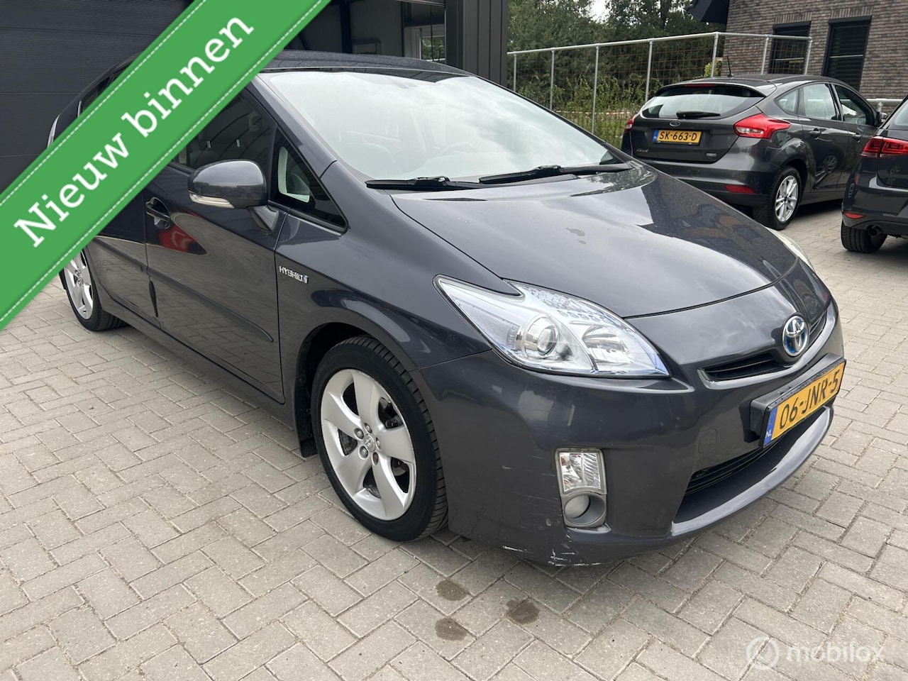 Toyota Prius - 1.8 Aspiration HUD Navi Keyless - AutoWereld.nl