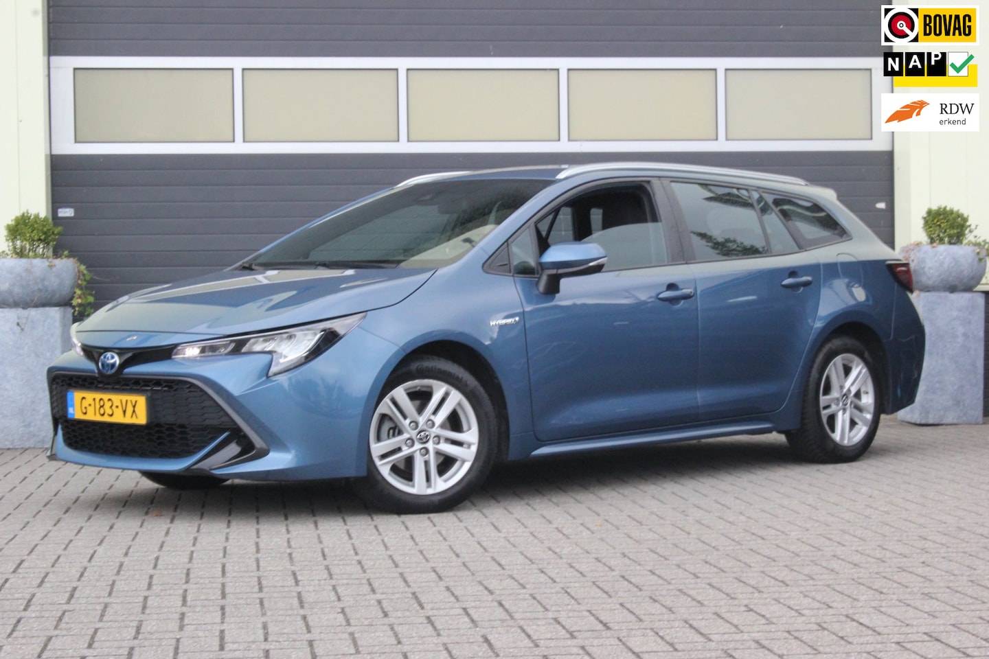 Toyota Corolla Touring Sports - 1.8 Hybrid Active | Trekhaak | Camera | - AutoWereld.nl