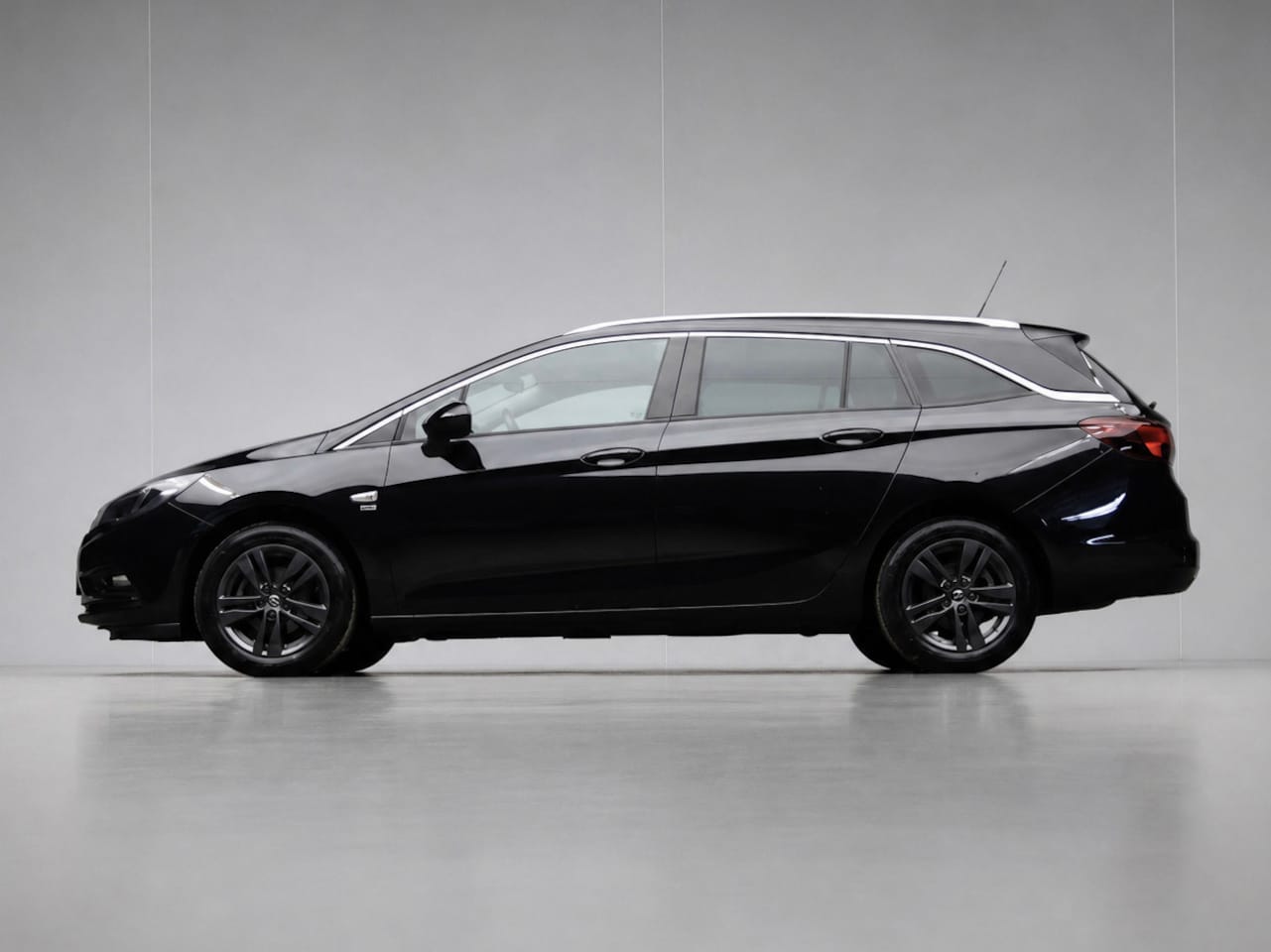 Opel Astra Sports Tourer - 1.0 Turbo 120 Jaar Edition Sport (APPLE CARPLAY,NAVI,PDC,CLIMATE,CRUISE,GETINT,SPORTSTOELE - AutoWereld.nl