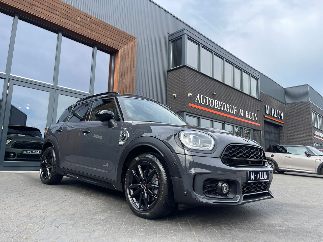 MINI Countryman - Mini 2.0 Cooper S E ALL4 John Cooper Works hybrid aut 220pk/leer/pano/camera/uniek - AutoWereld.nl