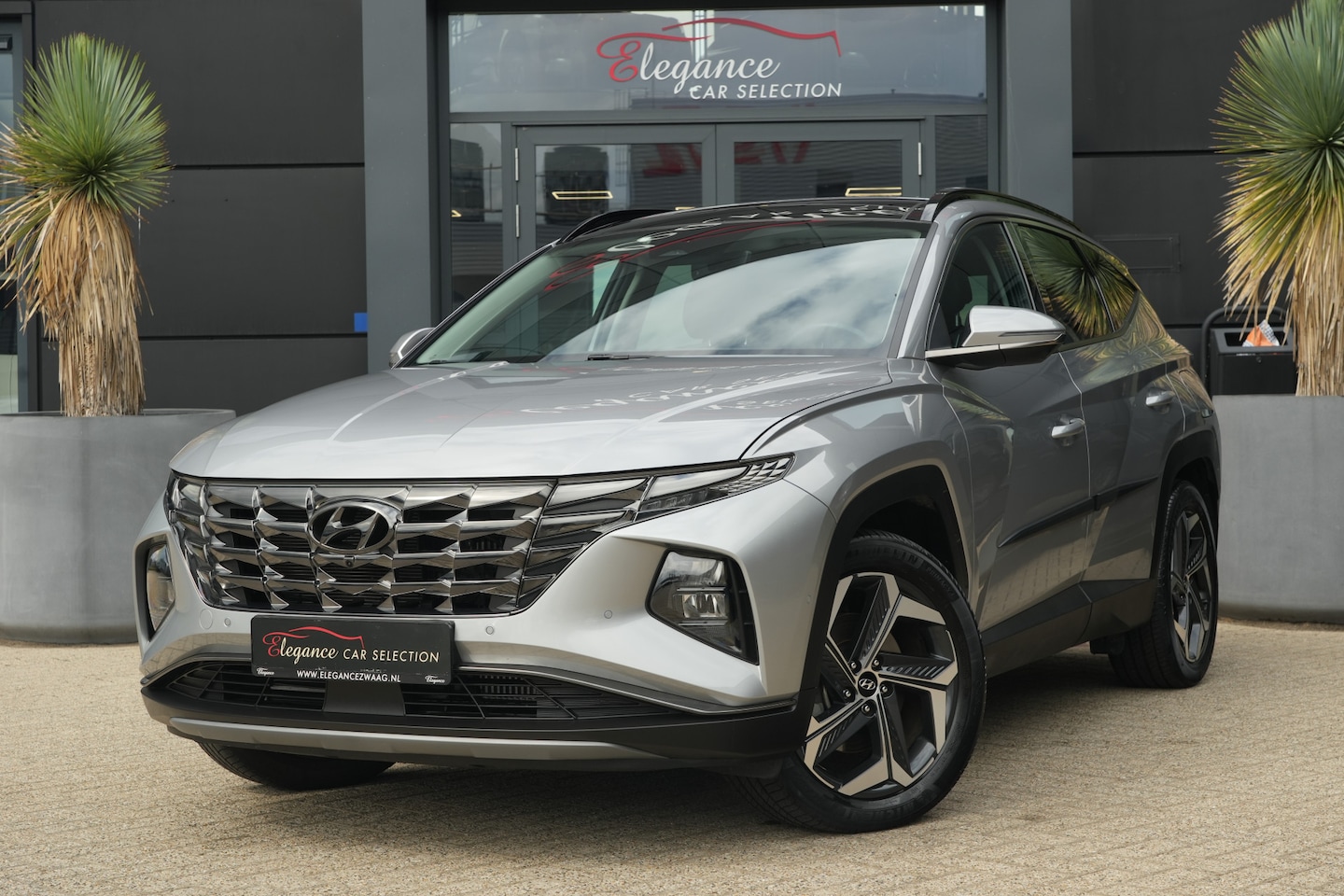 Hyundai Tucson - 1.6 T-GDI PHEV Premium Sky 4WD 265pk Panoramadak/Stoelverwarming/360Camera - AutoWereld.nl