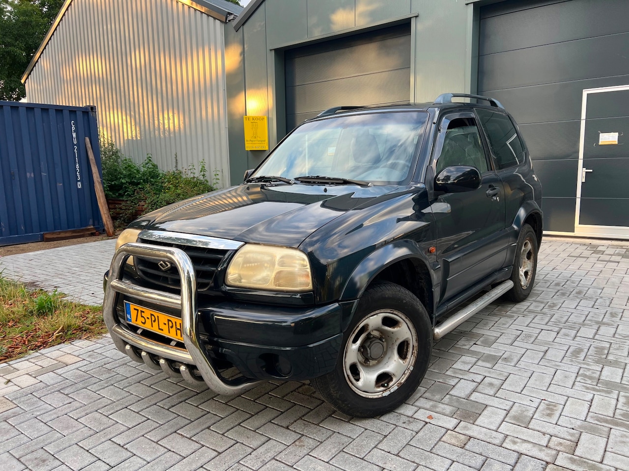 Suzuki Grand Vitara - 1.6 Metal Top Wide Body 1.6 Metal Top Wide Body - AutoWereld.nl