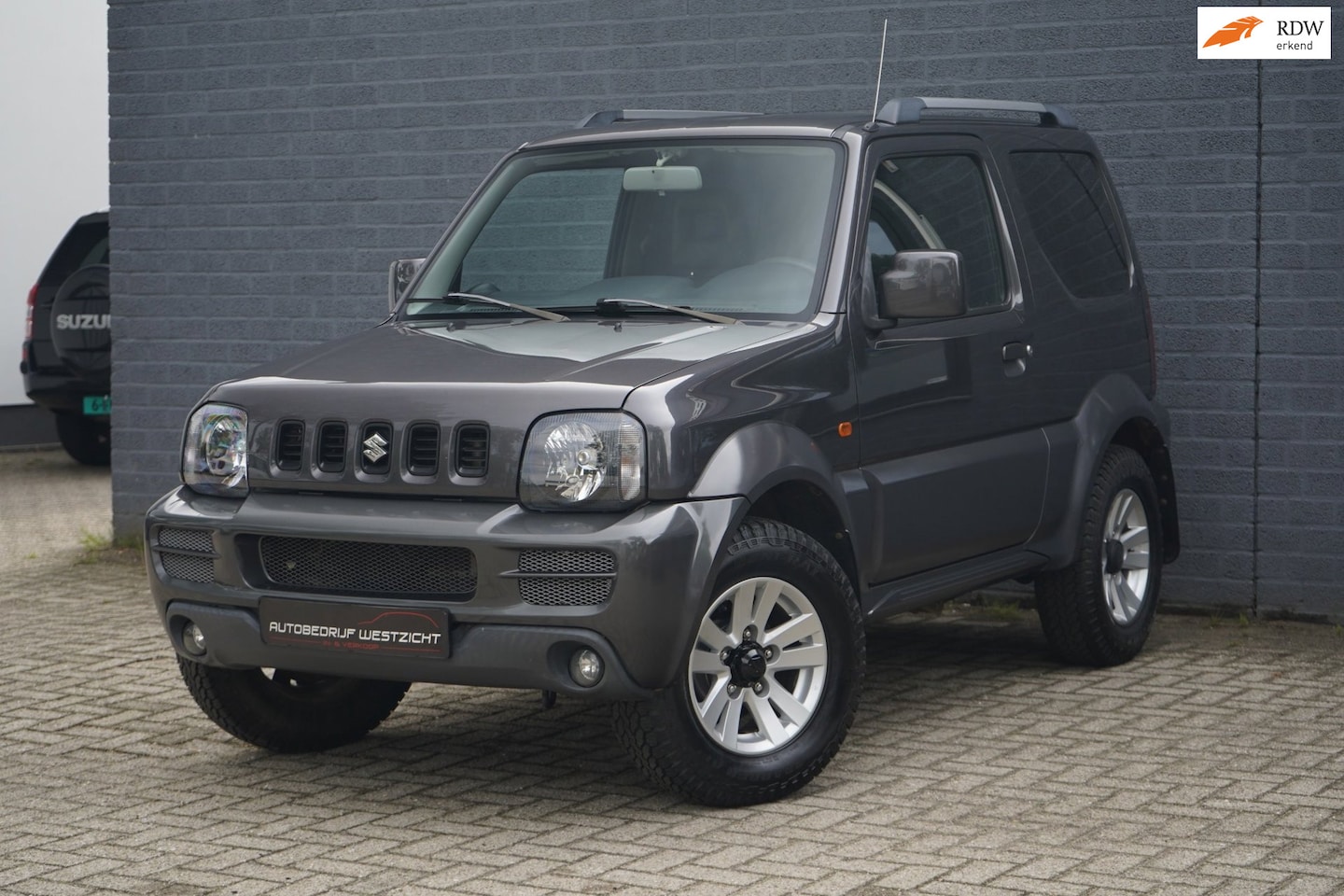 Suzuki Jimny - 1.3 Style! 4WD, Leder, Airco, Trekhaak, Stoelv. - AutoWereld.nl