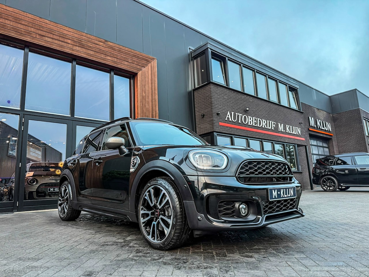 MINI Countryman - Cooper S E ALL4 John Cooper Works 220pk/Lounge leer/Hk/Camera/Btw/Vol - AutoWereld.nl