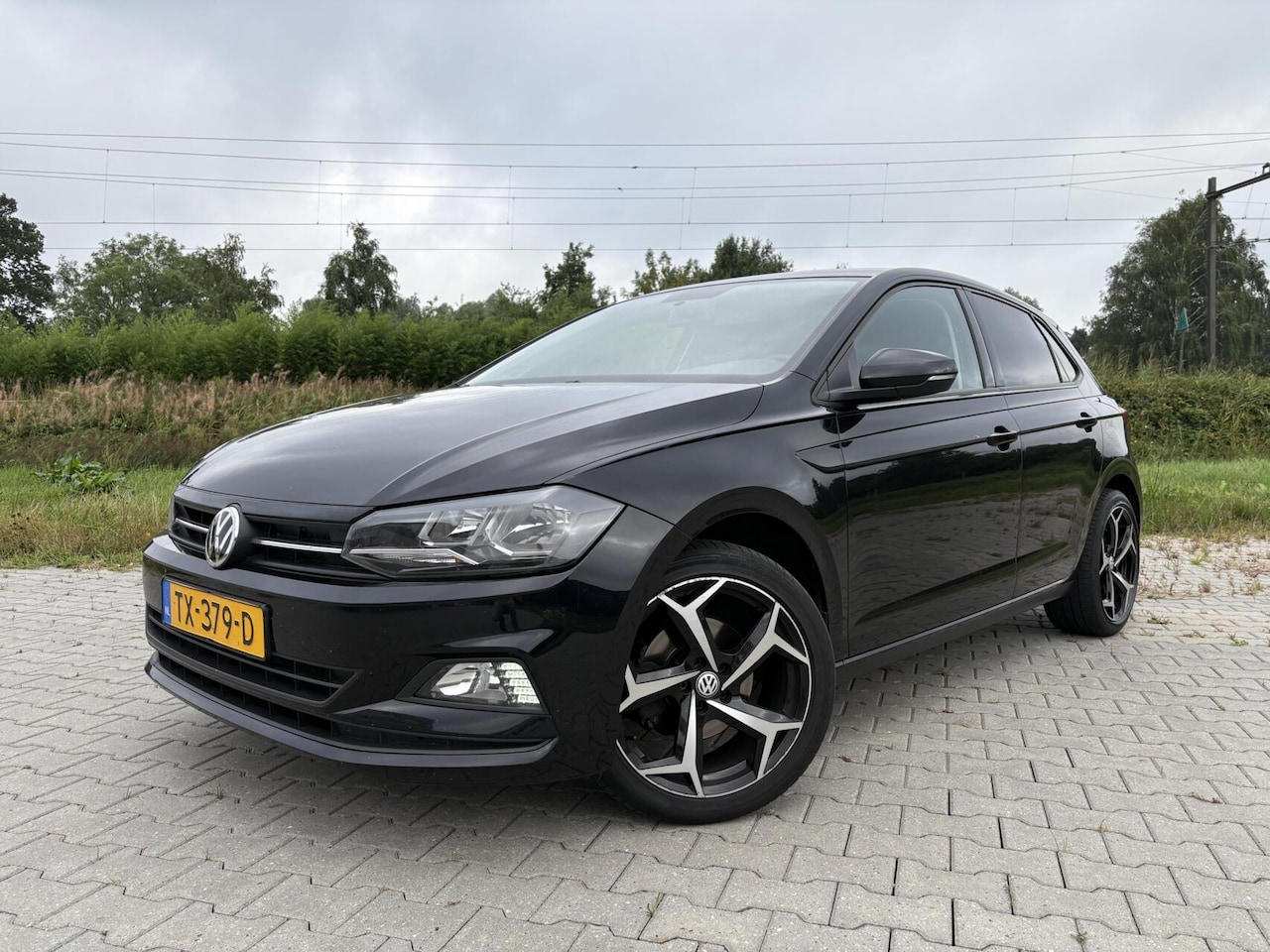 Volkswagen Polo - 1.6 TDI 5-Deurs Airco Navi CarPlay Trekhaak Cruise LED Sportvelgen - AutoWereld.nl