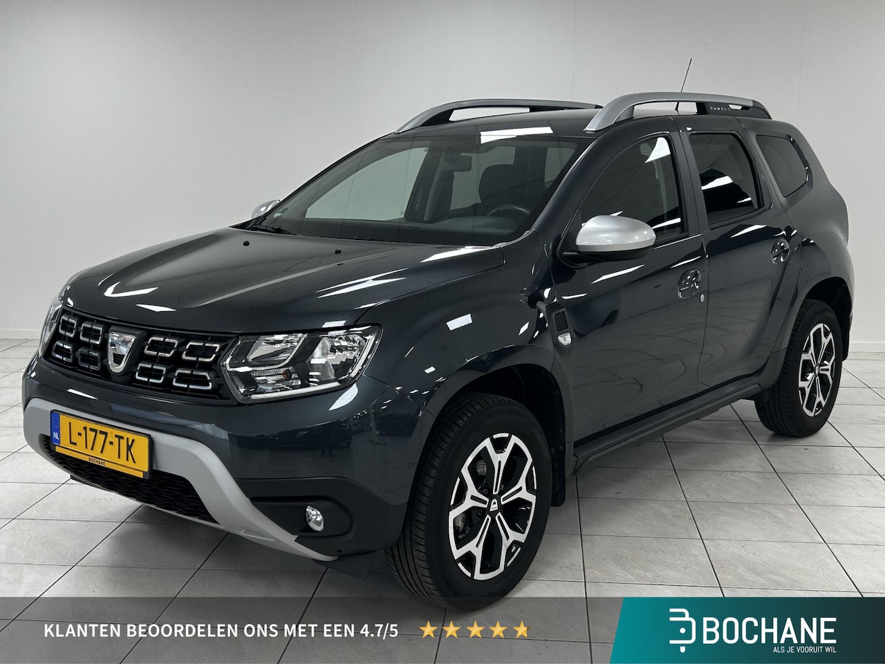 Dacia Duster - 1.3 TCe Prestige NAVIGATIE | TREKHAAK | ACHTERUITRIJCAMERA | LAGE KILOMETERSTAND! - AutoWereld.nl