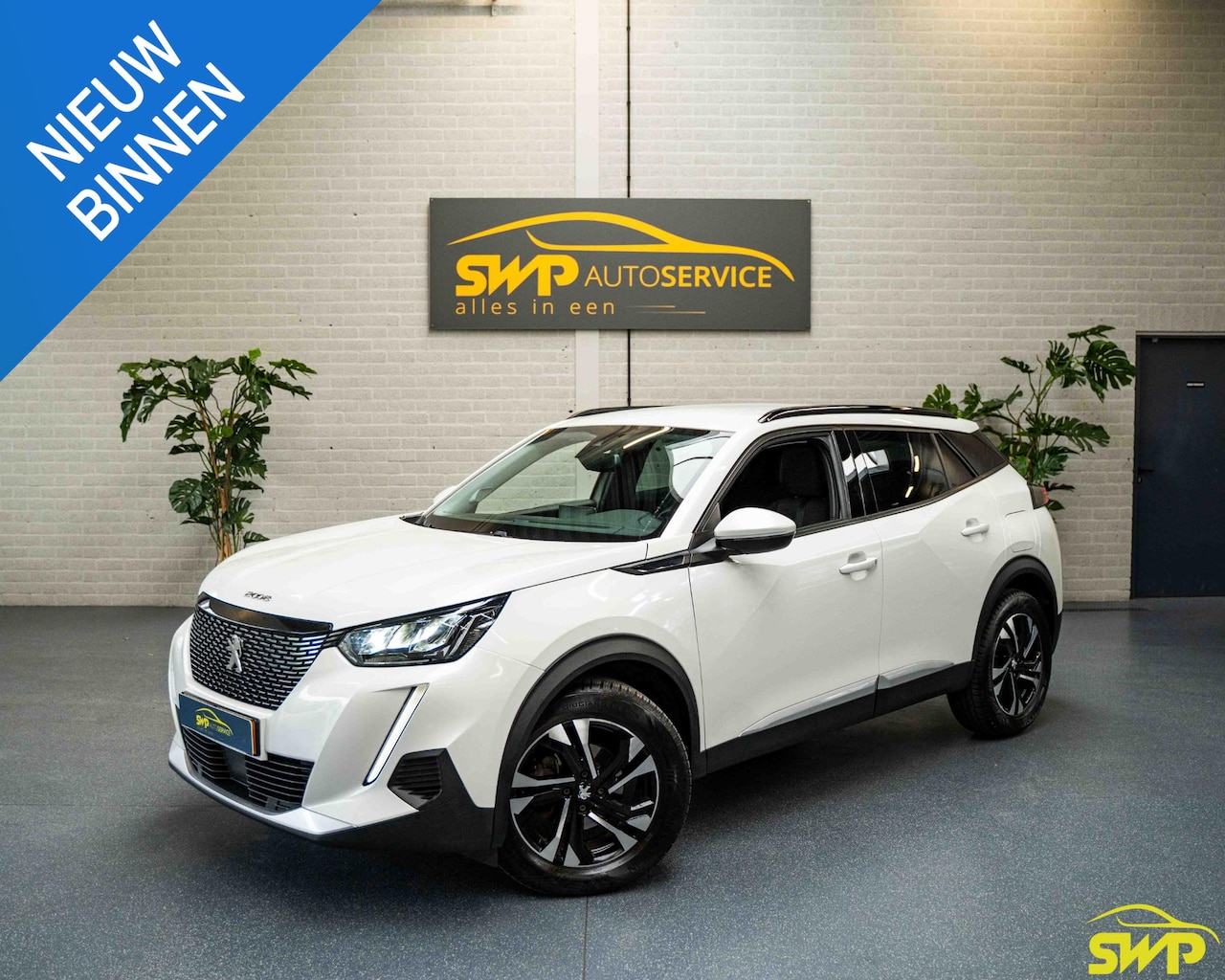 Peugeot 2008 - 1.2 PureTech Allure | Wit metallic | Navi via app | Cam | Nieuwe riem - AutoWereld.nl