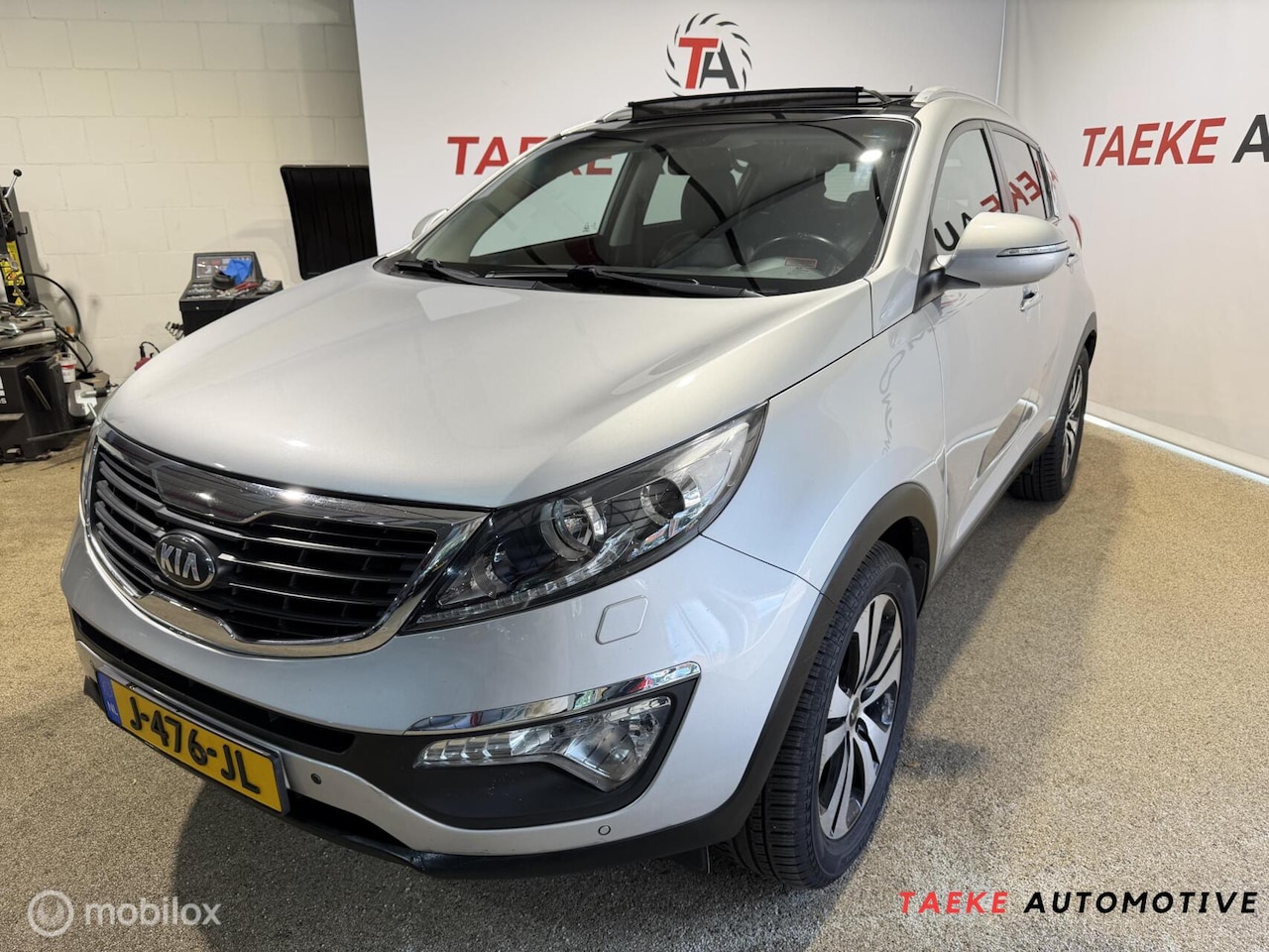 Kia Sportage - 2.0 Super Pack AUT/CLIMA/CRUISE/PANO/PDC/NAP - AutoWereld.nl