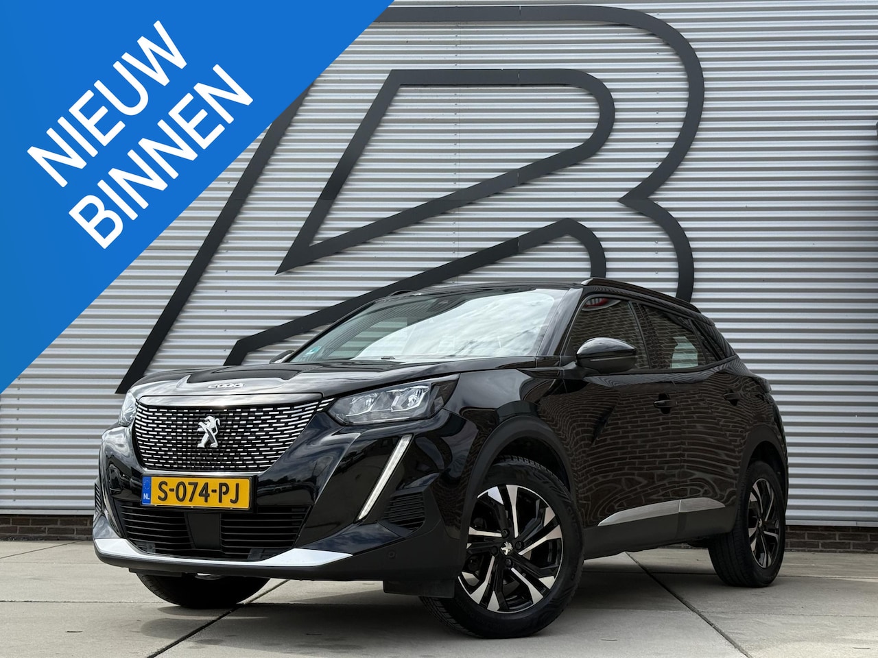 Peugeot 2008 - 1.2 PureTech Blue Lease Allure 1e Eigenaar|Navi|Camera|i-Cockpit|Clima|Cruise|Stoelverwarm - AutoWereld.nl